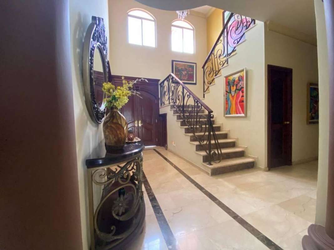 Spacious master bedroom with access to balcony luxury house Costa del Este Panama