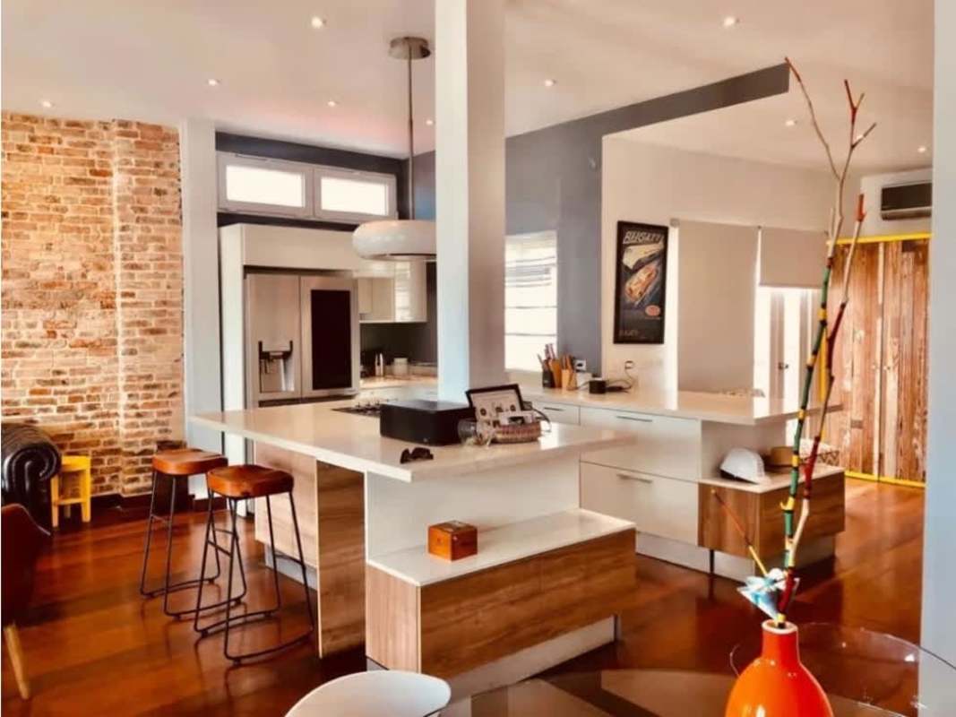 Contemporary loft kitchen with brick accent island in Casco Antiguo Panama