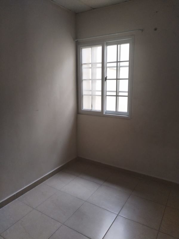 Small storage or office space tiled floor beige walls affordable home Pacora Panama