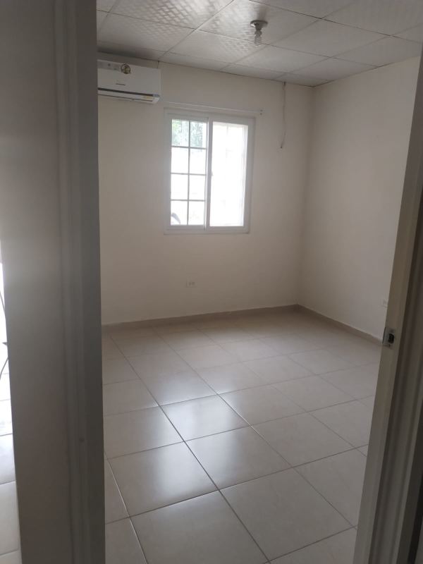 Kitchen with granite countertop white cabinets ceramic floor Mirador del Bosque Panama