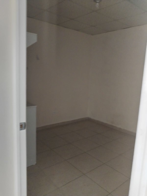 Bedroom with tile flooring plain walls window natural light in Cabra Pacora Panama