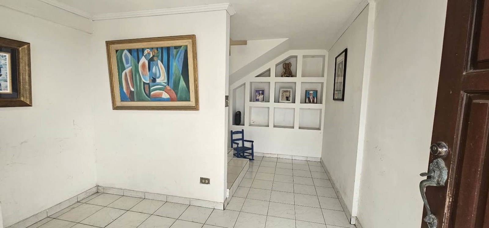 Large covered terrace area overlooking garden and backyard in house for sale Condado del Rey Panama