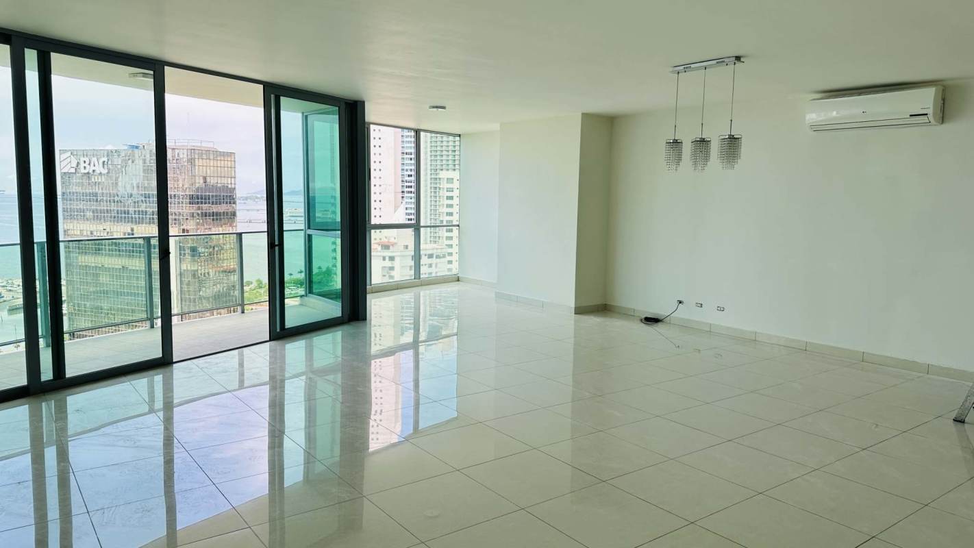 Modern spacious living room with ocean-facing balcony glass windows in PH Allure Panama