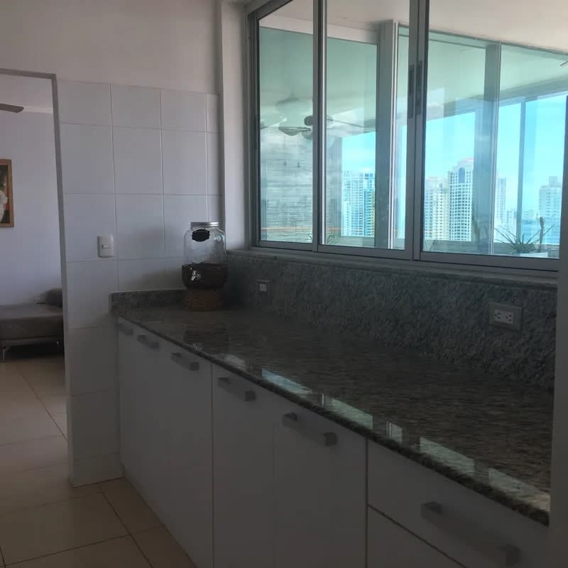 Kitchen with granite countertop, ample cabinets and large window in PH Sol del Este Costa del Este Panama
