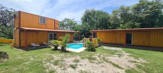 Two-level container cabin with terrace in country gated community Las Uvas Panama