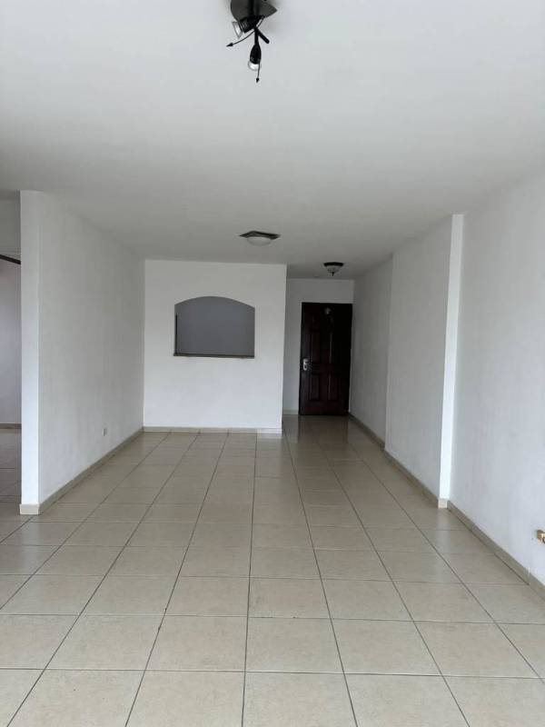 Kitchen with granite countertop, wood cabinets, and appliances at PH Porto Bello El Cangrejo Panama City