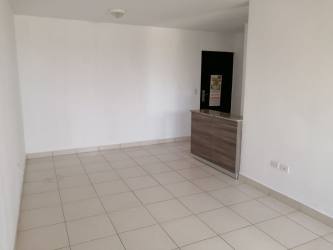 Living/dining area with bright tile floors, sliding doors to balcony PH Torres de La Chorrera
