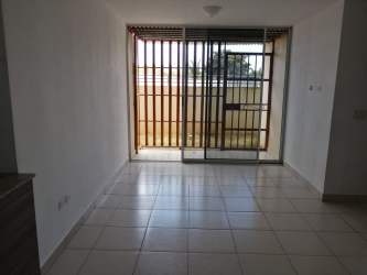 Multi-story modern apartment stone facade landscaped Panama La Chorrera