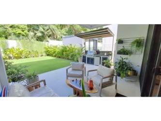 Open-concept kitchen and dining room with modern cabinetry and large dining table Explora Panama Pacifico