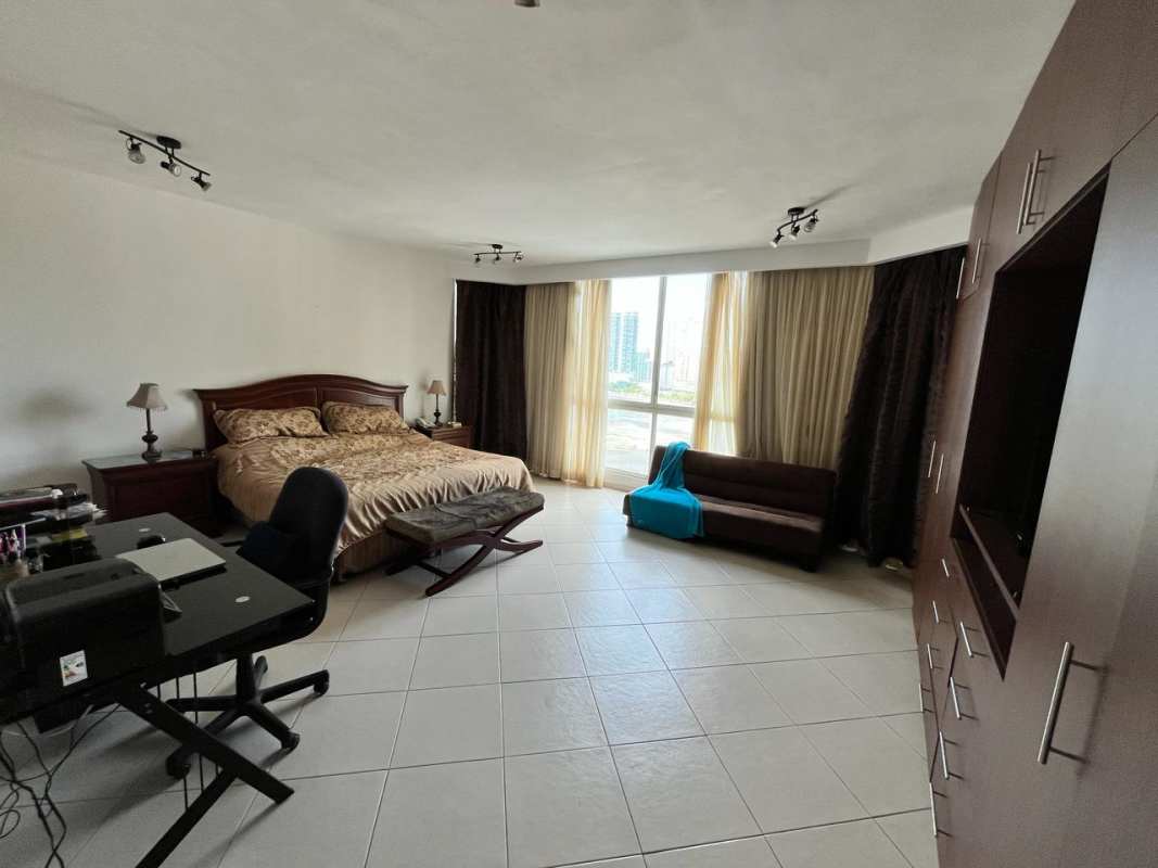 Master suite featuring balcony access, large windows, luxury finishes