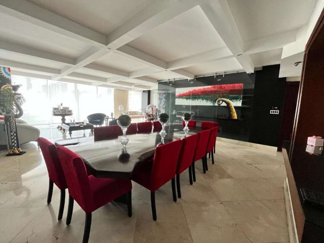 Modern dining area with floor-to-ceiling windows Pacific Ocean views