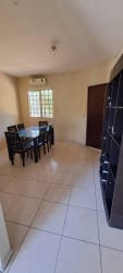 Dining room with air conditioning, tiled floors, window in house La Fontana David Panama