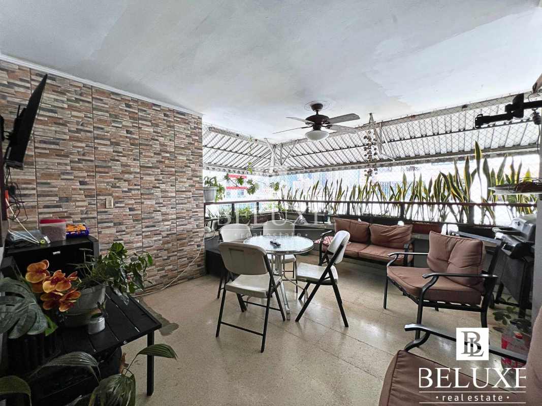 Bright modern kitchen with appliances and ceramic tile at PH Santa Fe El Carmen Panama City