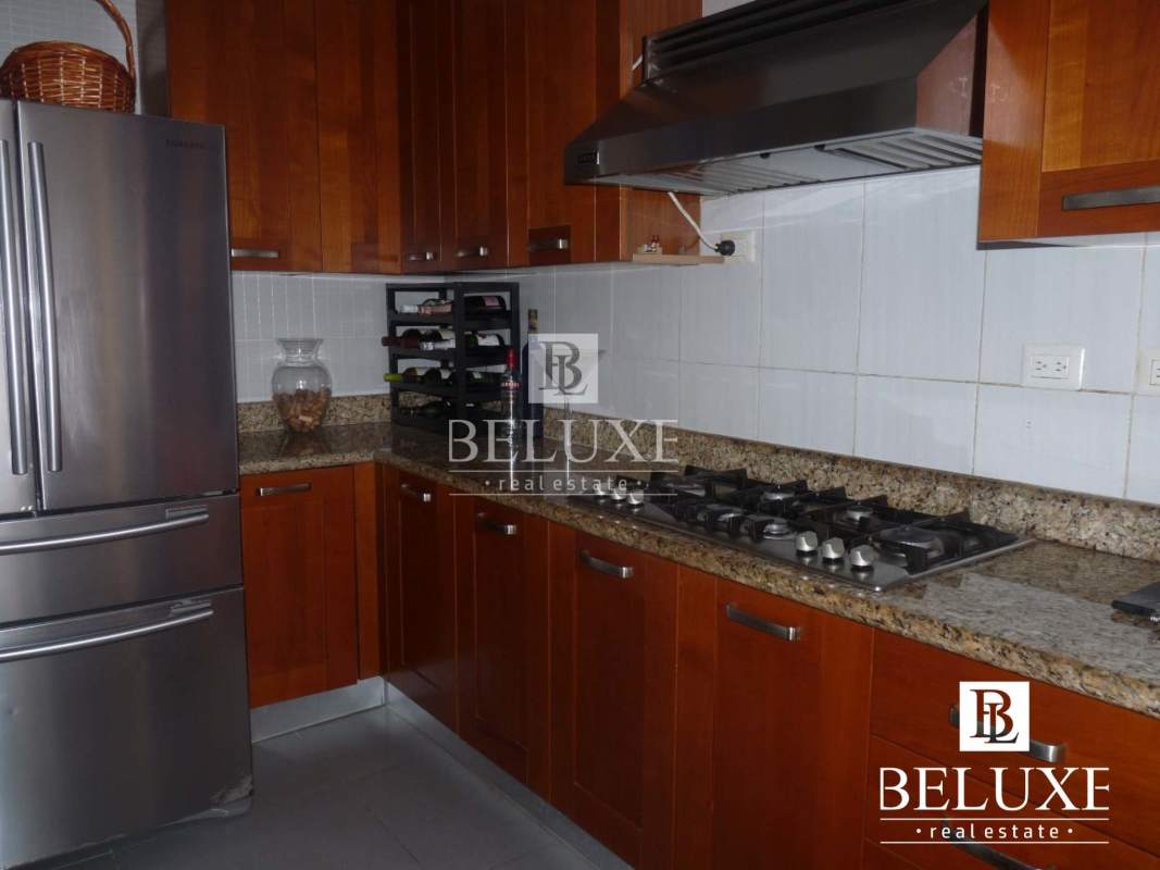 Open kitchen with dining table and large windows Panama City