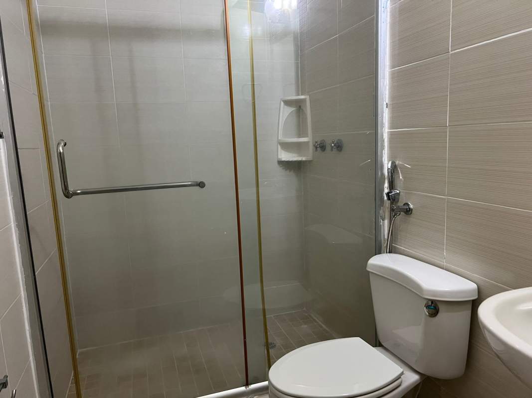 Outdoor swimming pool with sun deck and palm trees in PH Alpes Brisas del Golf Panama City