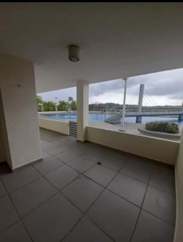 Open concept kitchen with granite countertops and appliances in PH Altamira Gardens