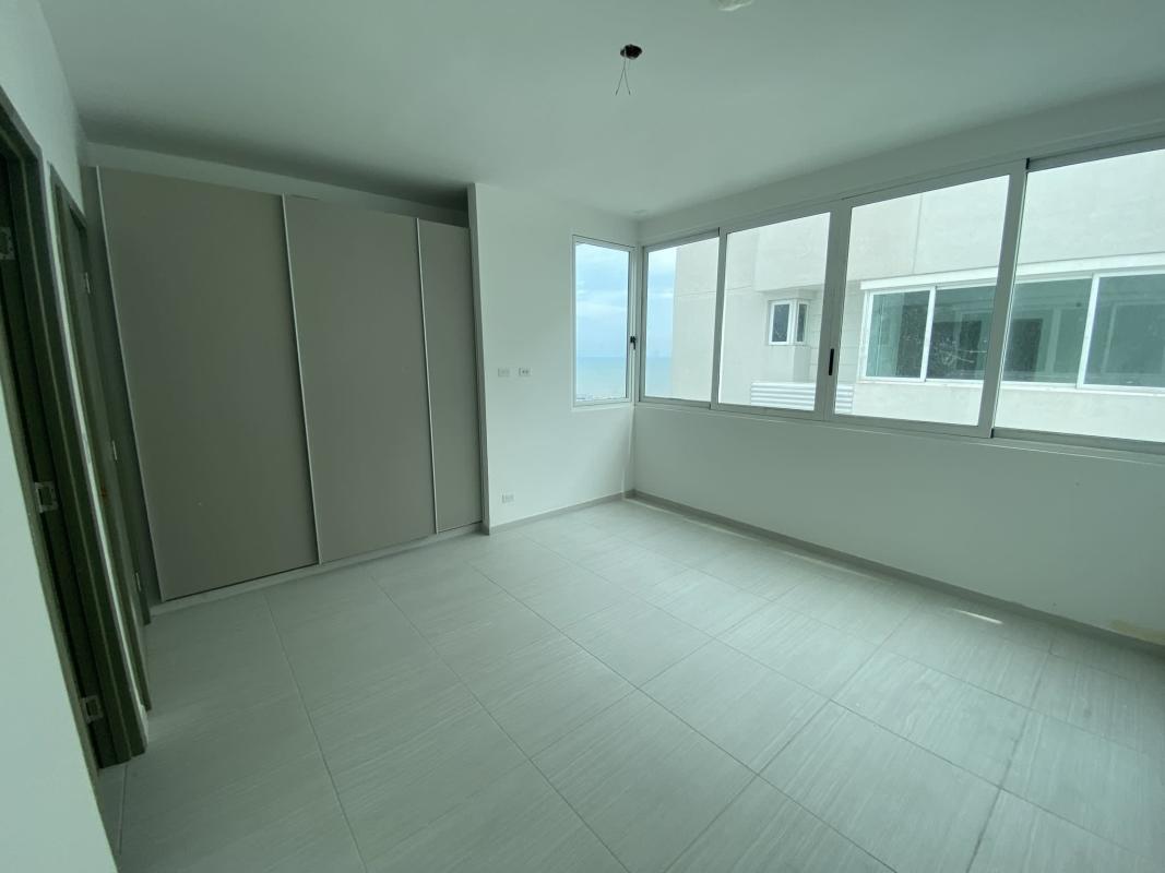 Modern kitchen with solid-surface counters and ceramic backsplash in penthouse at The Towers San Francisco Panama