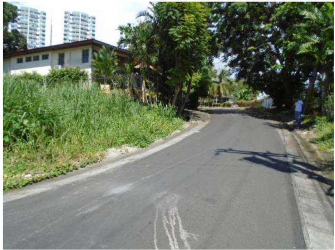 Street view of Betania residential lot with vegetation sidewalk and residential houses in Panama City