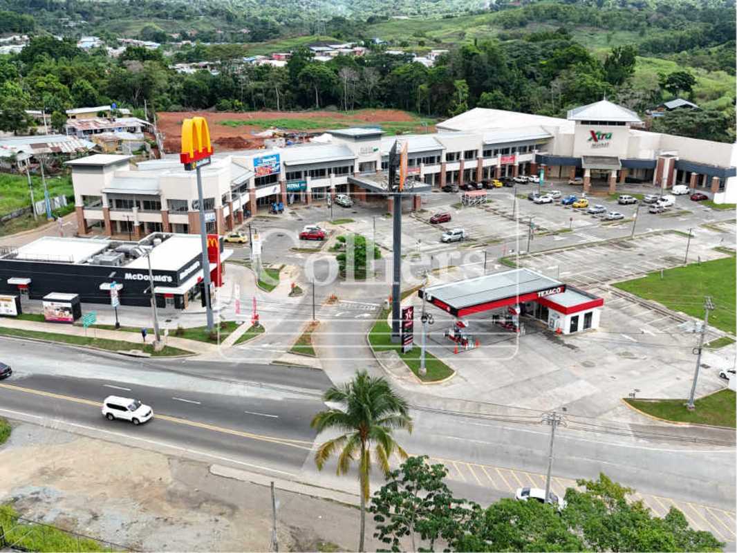 Aerial of McDonald's drive-thru adjacent retail shops in Plaza Villalobos Pedregal Panama City