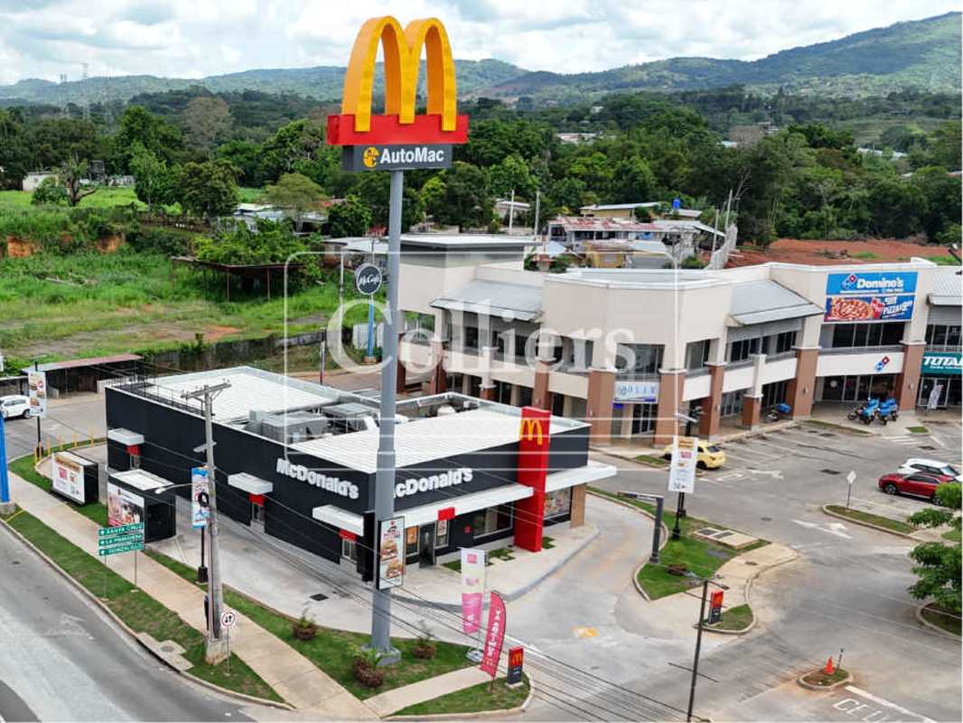 Aerial property photo showing highway, storage areas and construction equipment near Plaza Villalobos Panama