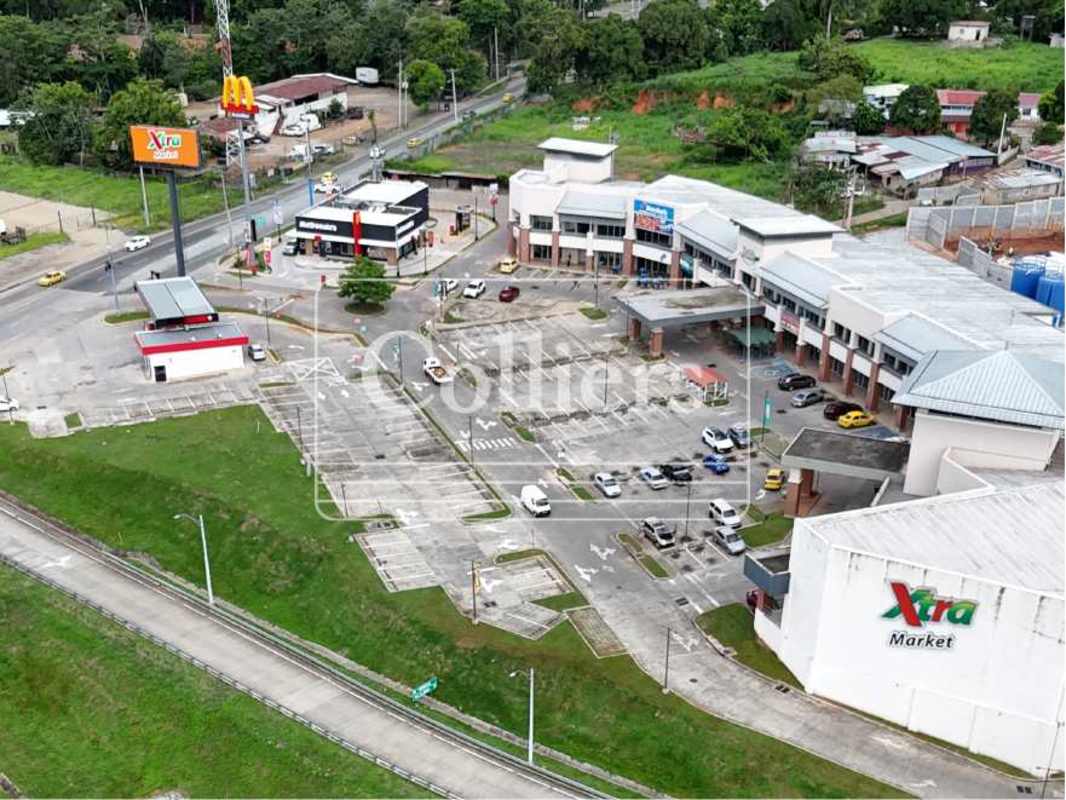 Aerial of retail outlets gas station and parking in Plaza Villalobos Pedregal Panama City