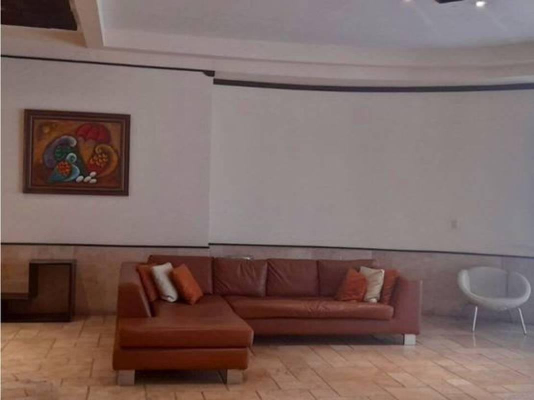 Large living room with ceramic tile flooring and curved design in PH Sunrise Tower Obarrio