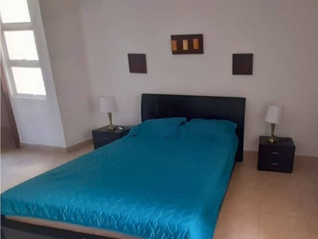 Bedroom with large window, tile floor and closet in Sunrise Tower Obarrio Panama
