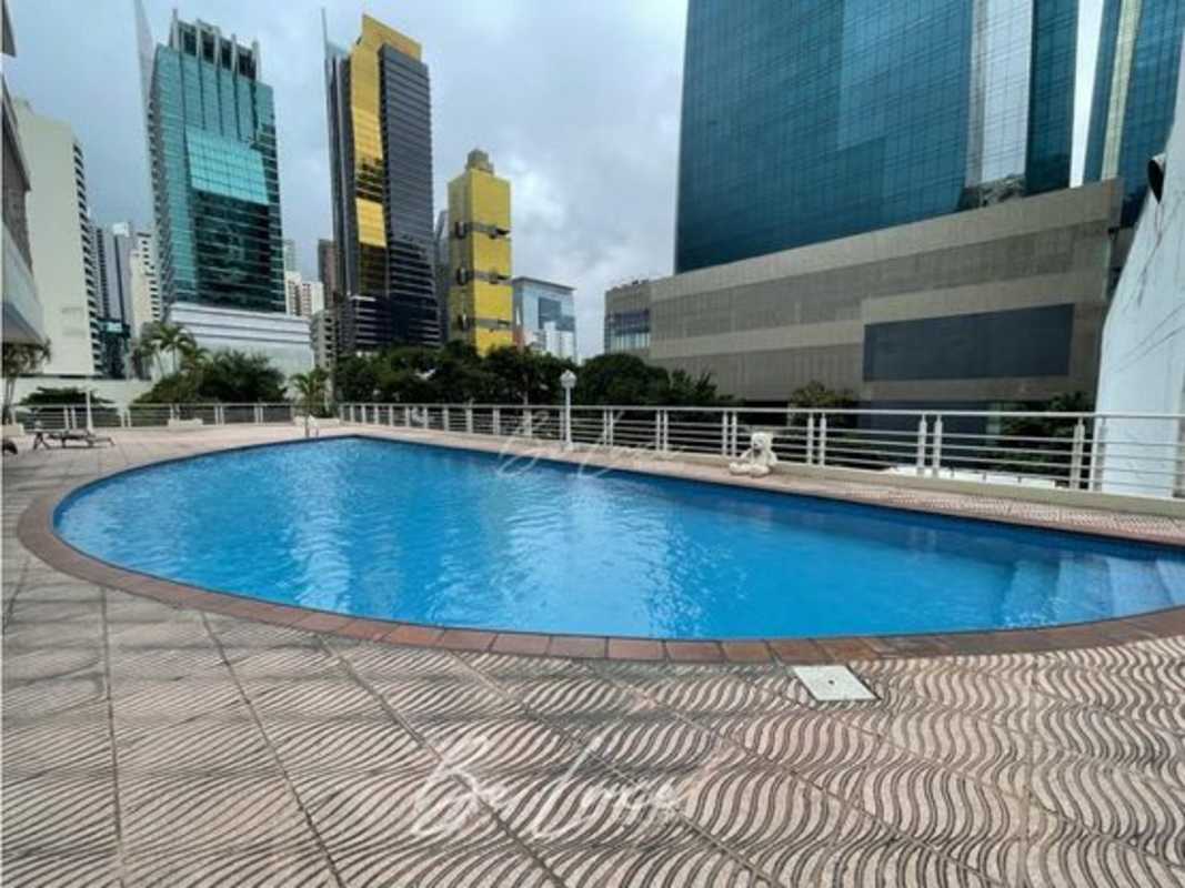 Community social lounge with glass tables and city view at Sunrise Tower Obarrio