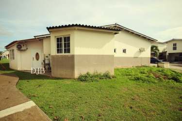 Open kitchen with granite breakfast bar and cabinetry in PH Villamarina Playa Dorada Panama