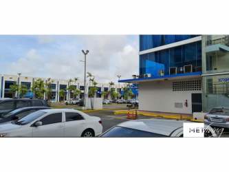 Modern glass facade of Millennium Plaza office towers in Colón Panama