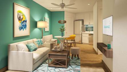 Contemporary kitchen with blue backsplash stainless appliances in beachfront condo Playa Caracol