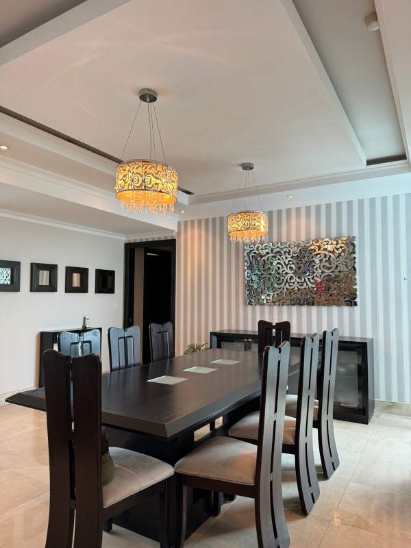 Formal dining space with modern decor inside luxury Ocean Two apartment Costa del Este Panama