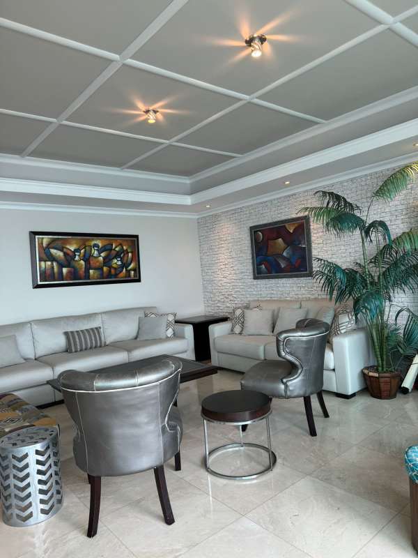 Living room with large windows and sea views at Ocean Two Tower Panama City