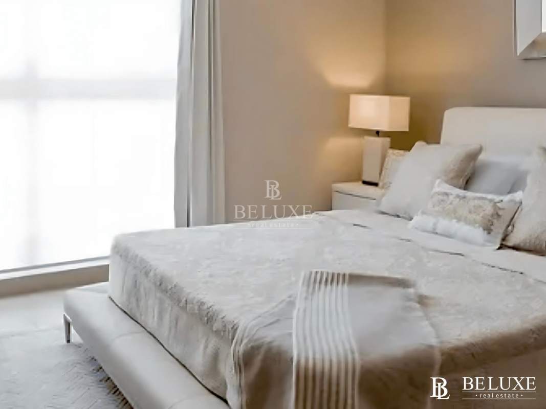 Modern kitchen with granite countertop and white cabinetry in PH Kings Park Panama City