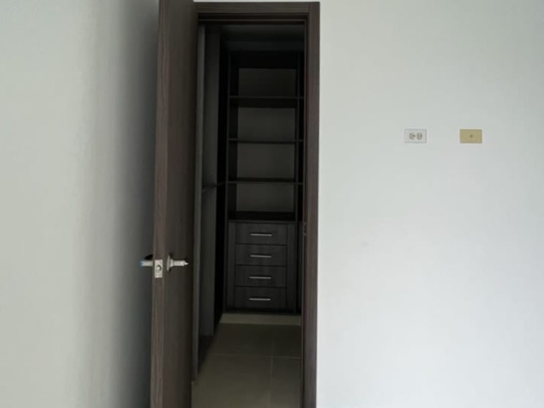 Modern spacious living room with sliding doors to balcony panoramic city views PH Kings Park Condado del Rey Panama