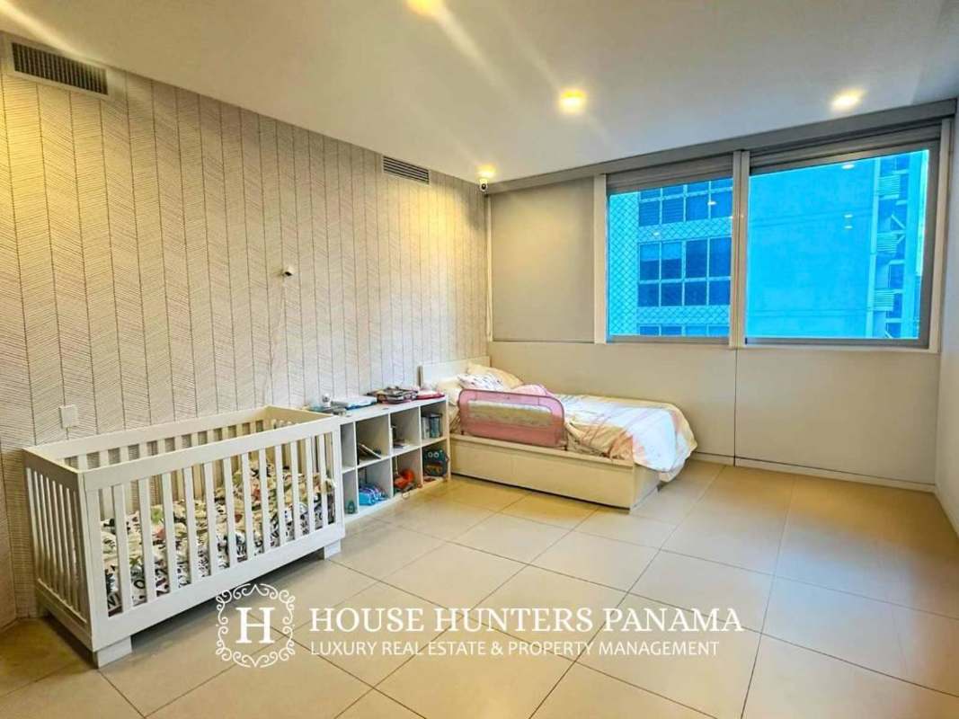 Modern open living room with panoramic windows and city views in PH Oceanaire Panama