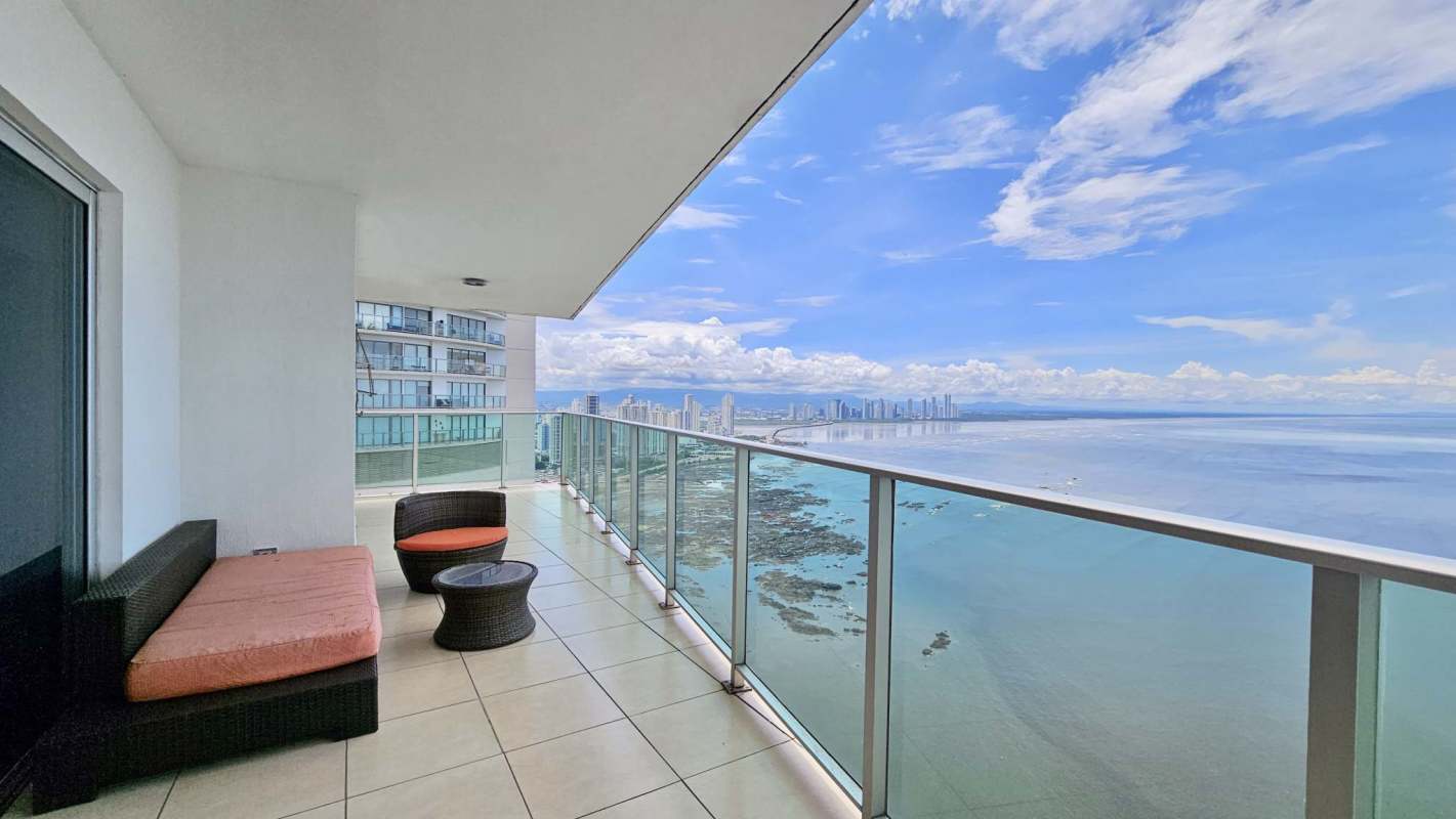 Bedroom with balcony access and ocean views at Oasis on the Bay Punta Pacífica Panama