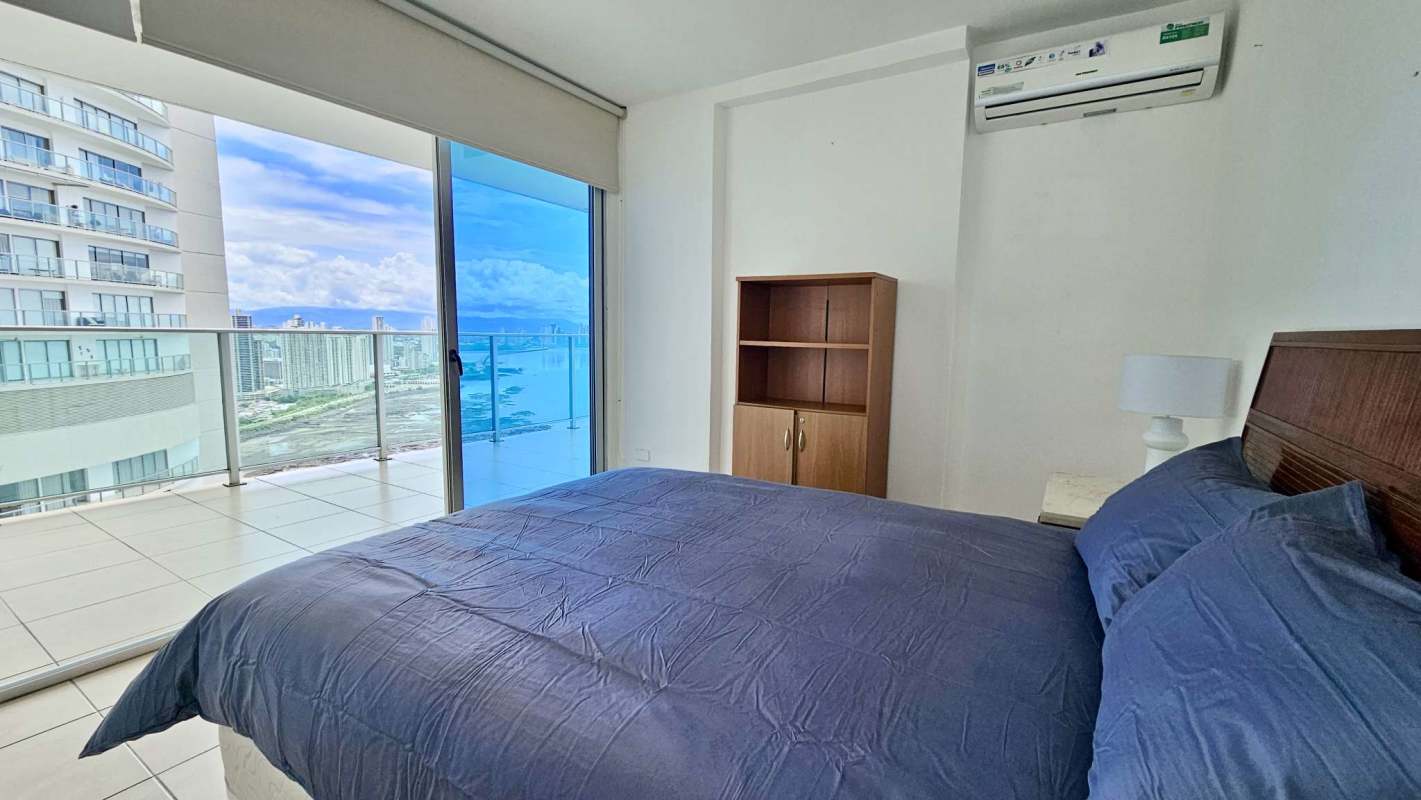 Master bedroom with floor-to-ceiling windows and Pacific skyline views Punta Pacifica Panama