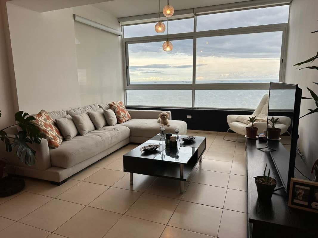 Contemporary apartment living area with sea view windows in PH Vista del Mar Panama