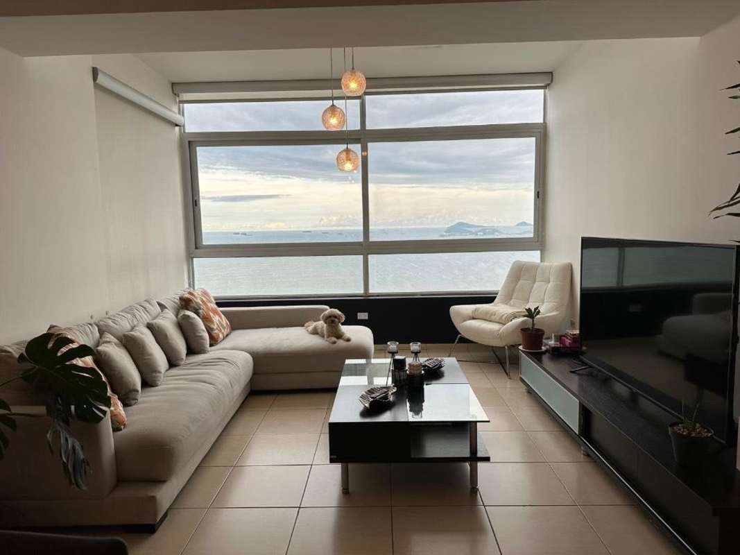 Dining area integrated with living room and ocean view balcony PH Vista del Mar Panama City