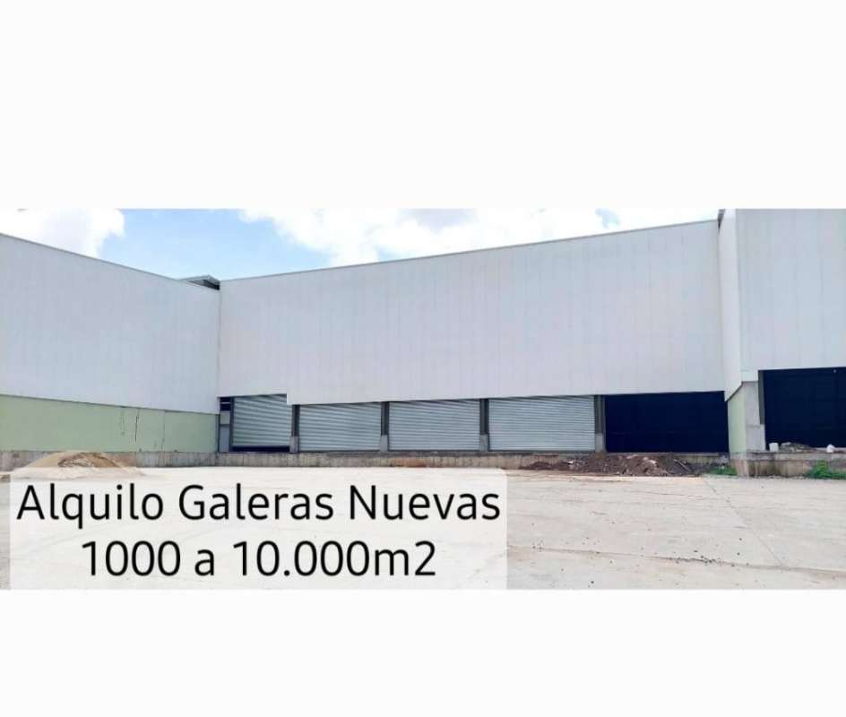 Exterior modern industrial warehouse complex with roller doors and wide yard in Las Mañanitas Panama