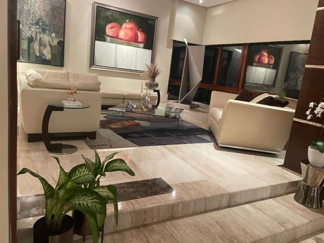 Family room with hardwood accents, recessed lighting and city skyline views in PH Waterfront Panama