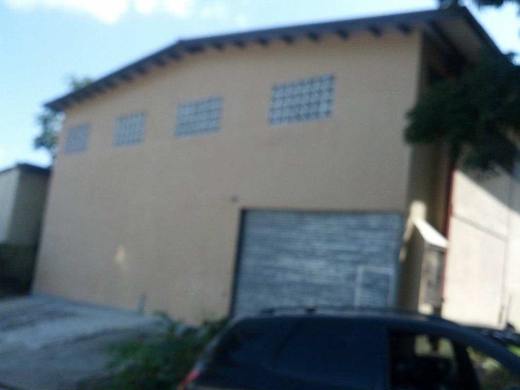 Empty industrial warehouse high ceiling concrete floor and metal roof Pueblo Nuevo Panama