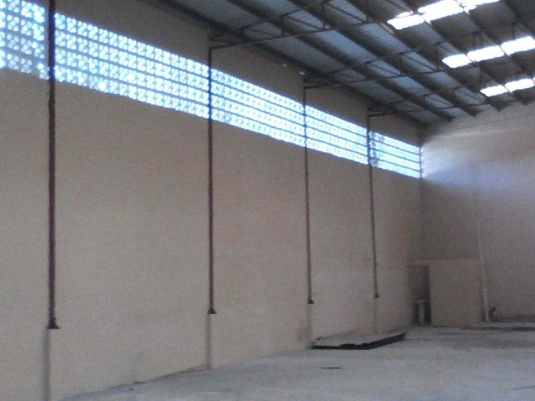 Warehouse space with metal roofing structure ventilation blocks and concrete floor in Pueblo Nuevo Panama