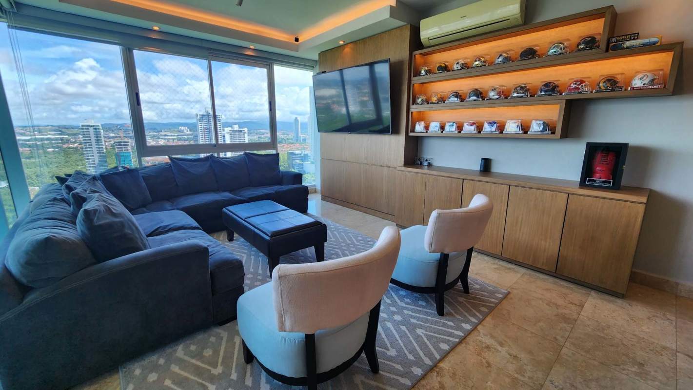 Spacious kitchen with granite countertops, wooden cabinets, stainless appliances in PH Titanium Panama City