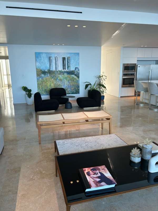 Contemporary living room with marble floors, sectional sofa, large windows in PH Ocean Sky Coco del Mar