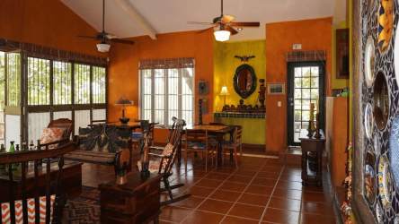 Spacious open living and dining area with vaulted ceilings and vibrant decor in Coronado beach home