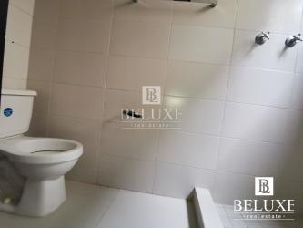 Backyard garden with covered terrace area in Woodlands Panama Pacifico house