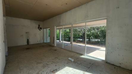 Hallway with multiple doorways, unfinished wall patches in Residencial Malibu Nueva Gorgona