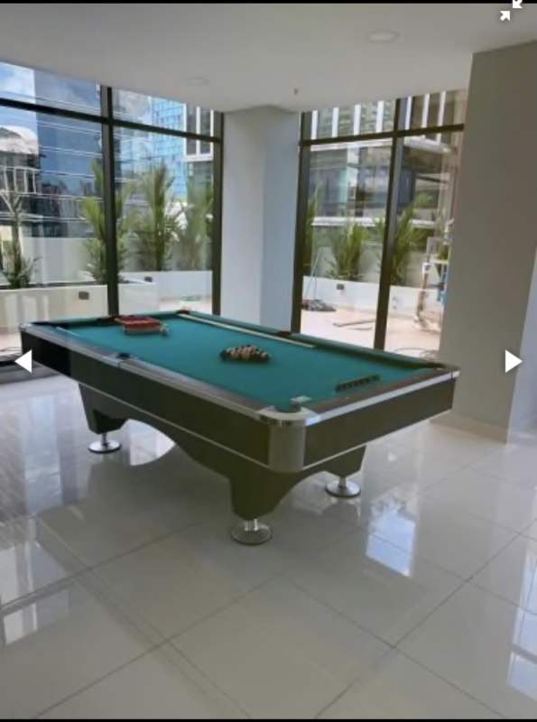 Game room with pool table ping pong city view PH Downtown Obarrio